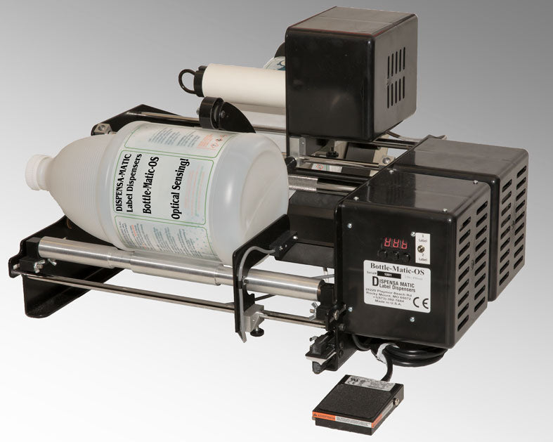 Applicatrice d’étiquettes semi-automatique pour bouteilles et contenants cylindriques
